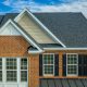 big brick house with new white windows