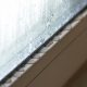 A close up image of the bottom of a window. You can see moisture forming on the window and on the sill holding it, which is a common sign of needing to replace a window.